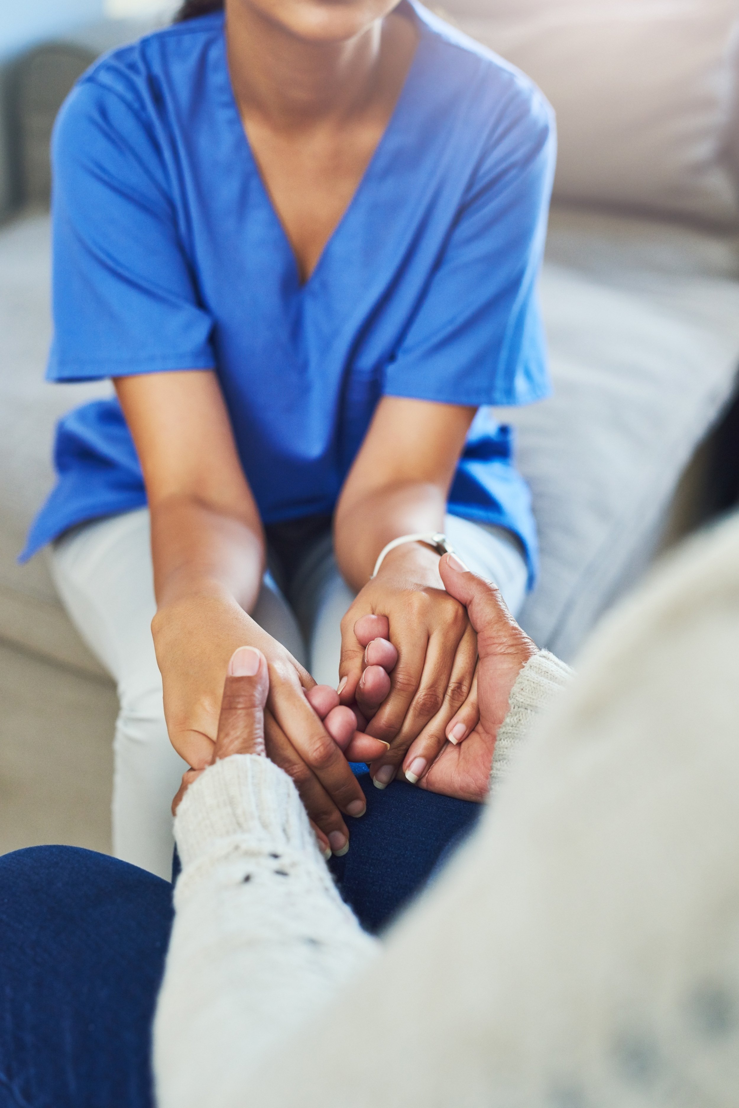 holding-hands-nurse-senior-woman-with-support-empathy-medical-with-grief-house-hope-closeup-health-professional-with-pensioner-caregiver-sympathy-with-comfort-compassion